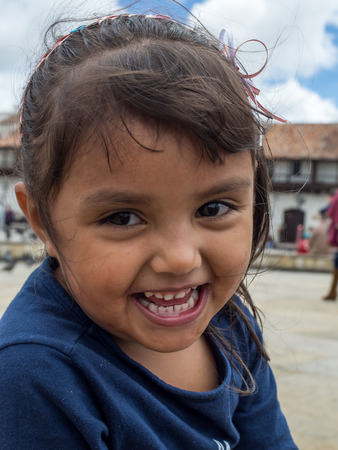 Tunja, Colombia - May 02, 2016: Portrait of a small girl  an inhabitant of the Tunja.のeditorial素材
