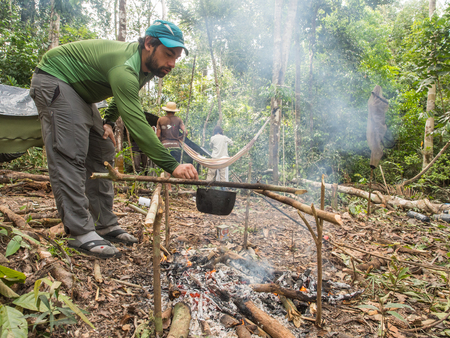 Lagoon of Jaguar, Brazil - May 7, 2016: Preparing meal in the Amazons jungleのeditorial素材