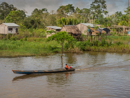 Amazon River, Peru - May 12, 2016: Small village on the bank of the Amazon Riverのeditorial素材