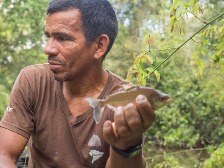 Palmari, Brazil - May 06, 2016: Resident of a Amazon jungle fishing  the piranha.のeditorial素材
