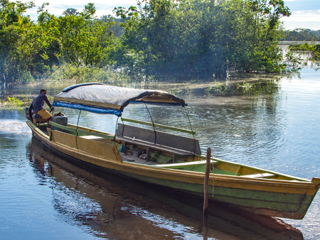 Palmari, Brazil - May 6, 2016: Wooden  boat  on the Javari riverのeditorial素材