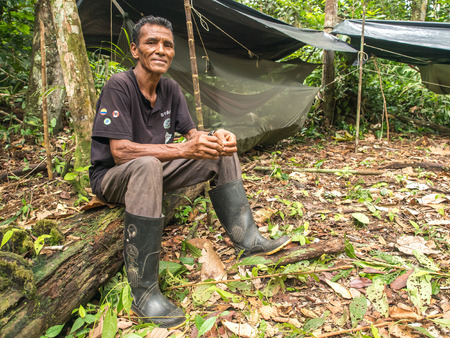 Jungle, Brazil - May 8, 2016:  Portrait of a man with a red skin in the Amazon  jungleのeditorial素材