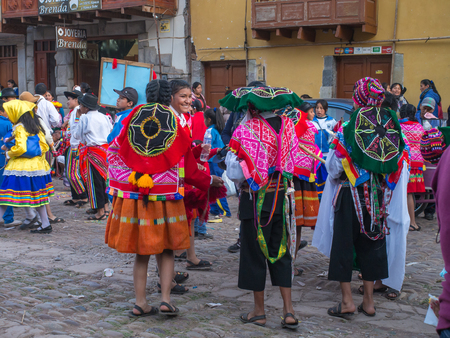 Pisac, Peru - May 19, 2016: Kids in colorful, folk costumes in the Pisac marketのeditorial素材