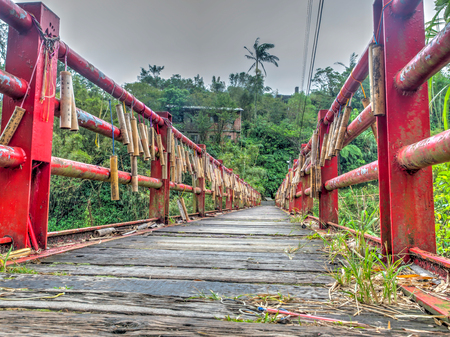 Jingtong, Taiwan - October 05, 2016: Bridge of lovers with  wishes written on bamboo sticks  hanging...