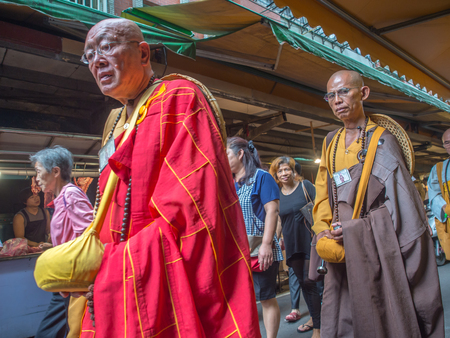 New Taipei City,Taiwan - October 04, 2016: Buddhist monks praying and collecting  donations on  a local marketのeditorial素材