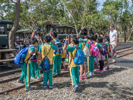 Luodong, Taiwan - October 18, 2016: A group of Taiwanese preschool children with colourful backpacks on a trip to Luodong Forestry Culture Gardenのeditorial素材