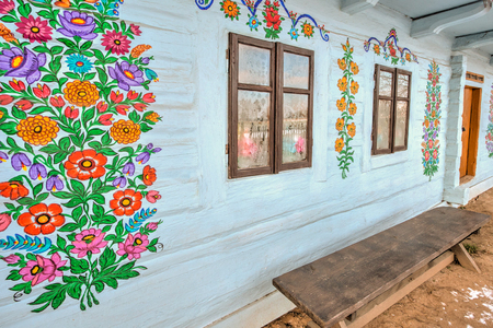 Zalipie, Poland - January  07, 2017: Colourful  log house in the yard of Felicia Curylowa in the village Zalipie in Malopolska, winter timeのeditorial素材