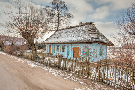 Zalipie, Poland - January  07, 2017: Colourful  log house in the yard of Felicia Curylowa in the village Zalipie in Malopolska, winter timeのeditorial素材