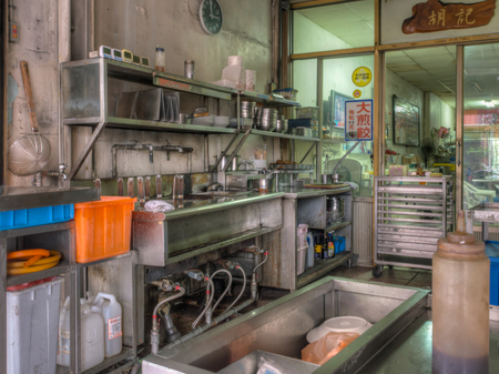 Tainan, Taiwan - October 11, 2016: Kitchen with dishes located on a street outside a building of Taiwanese restaurant . Cooking meals for guests fully visible  both for guests and those passing by.のeditorial素材