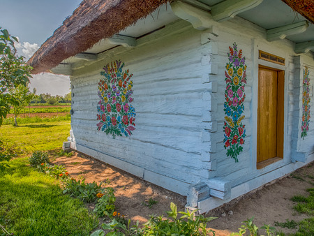Zalipie, Poland - May  20,  2017: Colourful  log house in the yard of Felicia Curylowa in the village Zalipie in Malopolska, spring  timeのeditorial素材