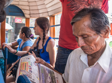 Santo Tomas, Peru - May 17, 2016: Peruvian man reading the newspaper in the local and  touristのeditorial素材