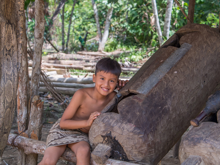 Iquitos, Peru- December 14, 2017: Small boy, Indian from Bora tribe in his local costumeのeditorial素材