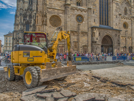 Vienna, Austria - May 23, 2017: Yellow digger working on the square before St. Stephen's Cathedral in Viennaのeditorial素材