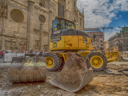 Vienna, Austria - May 23, 2017: Yellow digger working on the square before St. Stephen's Cathedral in Viennaのeditorial素材