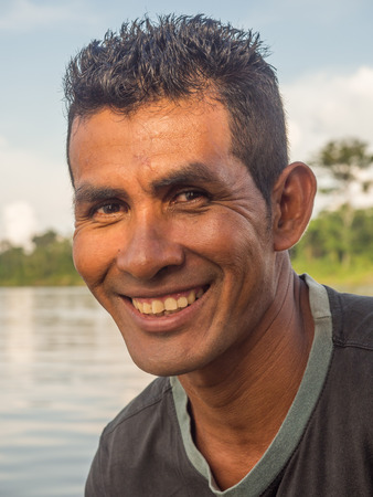 Jungle, Brazil - Dec 7, 2017:  Portrait of a man with a red skin in the Amazon  jungleのeditorial素材