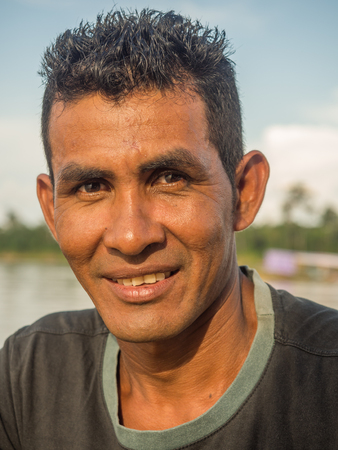 Jungle, Brazil - Dec 7, 2017:  Portrait of a man with a red skin in the Amazon  jungleのeditorial素材