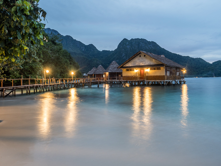 Ora Beach, Indonesia - February 12, 2018: Houses on the water  in Ora Beach Resort, in the evening time, Seram Island, Central Maluku, Indonesiaのeditorial素材