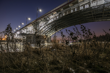 Warsaw, Poland - March 2 , 2018: Warsaw by night. Poniatowskiego bridge. Vistula river.のeditorial素材