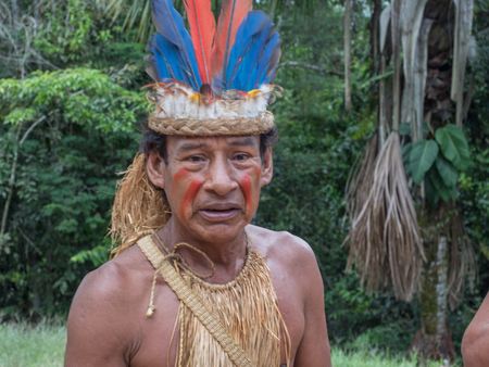 Iquitos, Peru- Mar 28, 2018: Indian from Yagua tribe in his local costumeのeditorial素材