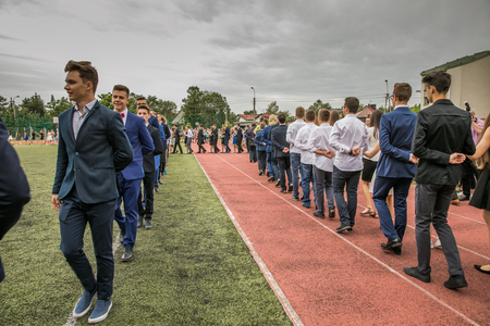 Jozefow, Poland - June 21, 2017: Polonaise dancing on the last day of the school year in one of the Polish secondary schools.のeditorial素材