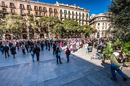 Barcelona, Spain - February 03, 2013: People holding hands and dancing national dance Sardana in...