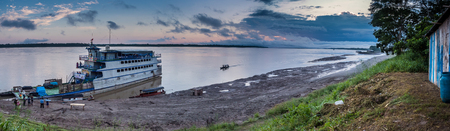 Caballococha, Peru - Sep 23, 2018: Cargo boat in the port on the Amazon river near Caballococha village. Boat cannot go to the town as the level of water is very lowのeditorial素材