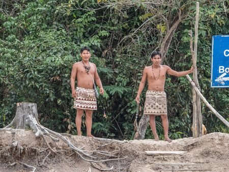 Iquitos, Peru- Sep 26, 2018: Indians from Bora tribe in his local costumeのeditorial素材