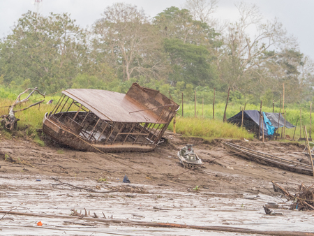 Tabatinga, Brazil - September 22, 2018:  Boat stuck on the bank of the Amazon river during low water season.のeditorial素材