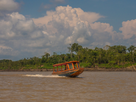 Amazon River, Brazil: - Sep 15, 018: Speed boat with locals on the Amazon River. Local traffic from Tabatinga to Benjamin Constant. Latin America.のeditorial素材
