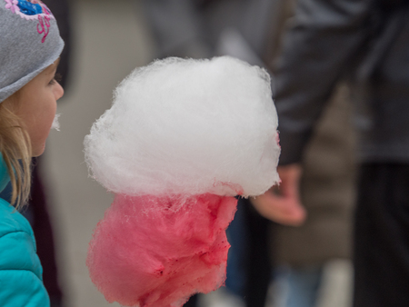 Jozefow, Poland - November 11, 2018: Children with white and red cotton candy in the colors of the polish flag. Celebration of 100 anniversary of Polish independence. Polandのeditorial素材