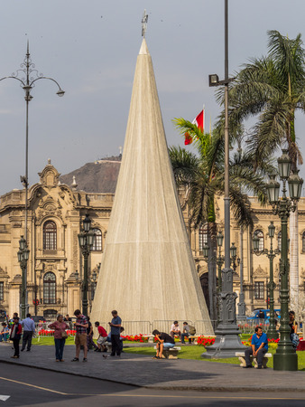 Lima, Peru - December 07, 2018: Big, white Christmas tree waiting for a Christmas time in Lima.  In the background Government Palace, Plaza de Armas, Peru, South America. Latin Americaのeditorial素材