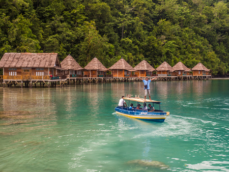 Ora Beach, Indonesia - February 14, 2018: Houses on the water  in Ora Beach Resort, Seram Island, Central Maluku, Indonesiaのeditorial素材