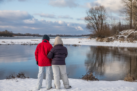 Woman and the boy on the Bank of the Vistula river during the winter. Poland. Natura 2000の写真素材