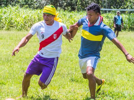 Santa Rita, Peru - Sep 19, 2018: Local people playing football in a small village in the middle of the Amazon Rain Forest, Border of Peru and Brazylia.のeditorial素材