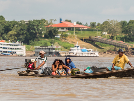 Tabatinga, Brazil - Sep 21, 2018: People on the boat from Ticuna tribe  (MagÃ¼ta, Tucuna, Tikuna, or Tukuna]). They are an indigenous people of Brazil, Colombia and Peru. Most numerous tribe in the Brazilian Amazonのeditorial素材