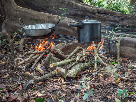 Lagoon, Brazil - November  27, 2017: Cooking on the fireplece on the camp in the amazons jungleのeditorial素材
