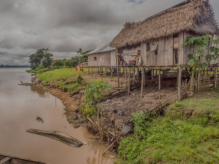 Amazon River, Peru - December 04 , 2018:  View of village on the bank of the Amazon River. South America.のeditorial素材