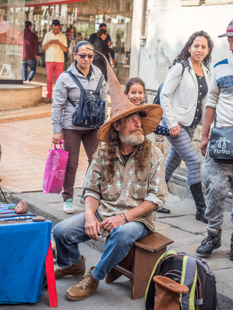Bogota, Colombia - November 23, 2018: Seller with beard in the brown hat on the street of BogotÃ¡ in La Candelaria district. South Americaのeditorial素材