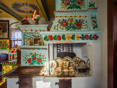 Zalipie, Poland - January  07, 2017: Colourful room in the log house  of Felicia Curylowa in the...