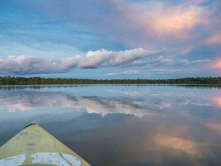 Amazonia. Sunset view seen from the kayak. Coati Lagoon near the Javari River, the tributary of the Amazon River. Selva on the border of Brazil and Peru. South America.の写真素材