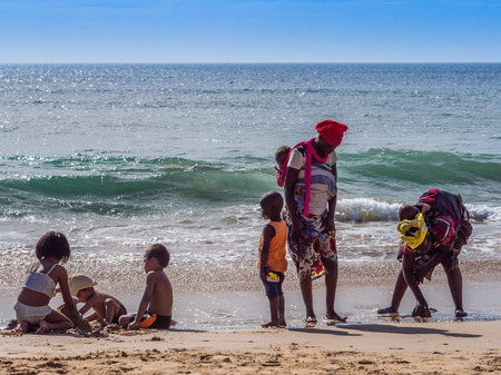 Photo for Dakar, Senegal - February 3, 2019: Senegalese family on  sandy beach in Dakar. Africa. - Royalty Free Image