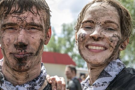 Portrait of young boy and girl  in dirty clothesの写真素材