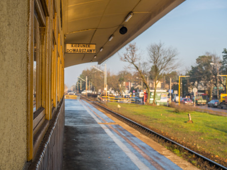 JÃ³zefÃ³w, Poland - November 23,  2017: Lonely woman on a railway station in Jozefow, 'Direction Warsaw'のeditorial素材