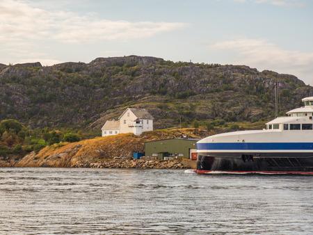 Bodo, Norway - August 20, 2019: Norwegian ferry from Bodo to Moskenes and white house on the hill. Nordland. Europe. Lofoten Gateのeditorial素材