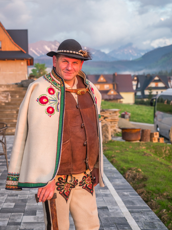 Tatry, Poland - June 03, 2019: An ethnic highlander (GÃ³ral)  in traditional goral dress with black hat and shepherd's axe in Polish Tatra mountains. Goral from Zakopane. Eastern Europeのeditorial素材