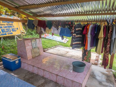 Ambon, Maluku, Indonesia - February 11, 2018: The colorful graves of a family members in the yard...