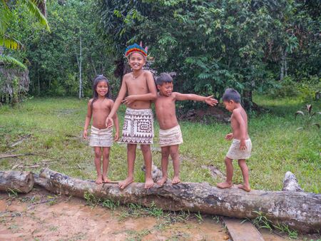 Iquitos, Peru- December 11 2019: Indian from Bora tribe in his local costume.のeditorial素材