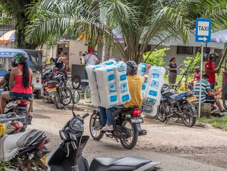 Leticia, Amazonas, Colombia, DEc 07, , 2019: Various rickshaws, motors and cars  on a  street of a small town.  Amazonia. Latin America. Colombiaの写真素材