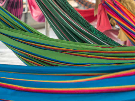 Amazon River, Peru. Beautiful, colorful hammocks on the cargo boat. Amazonia, trail from Santa Rosa to Iquitos. South Americaの写真素材