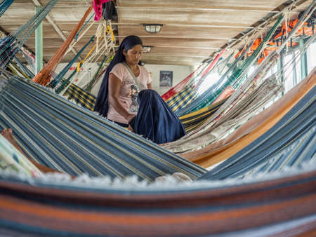 Amazon River, Peru - Dec 12, 2017:  Israelis between beautiful, colorful hammocks on a transport...